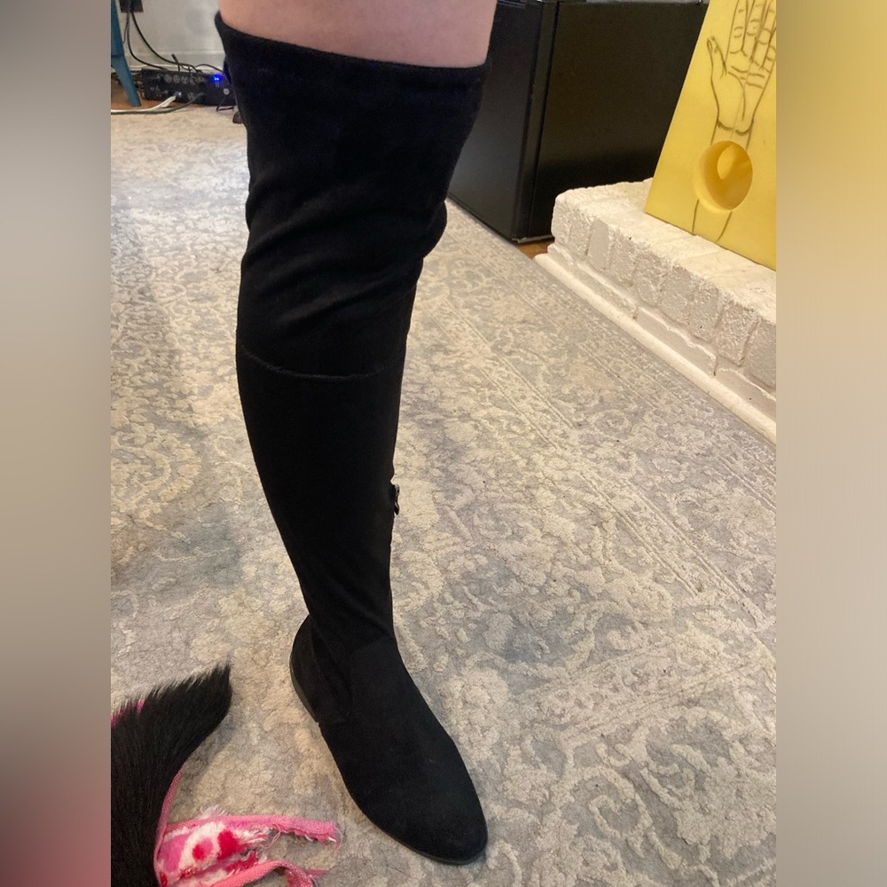 She & In over the knee boot